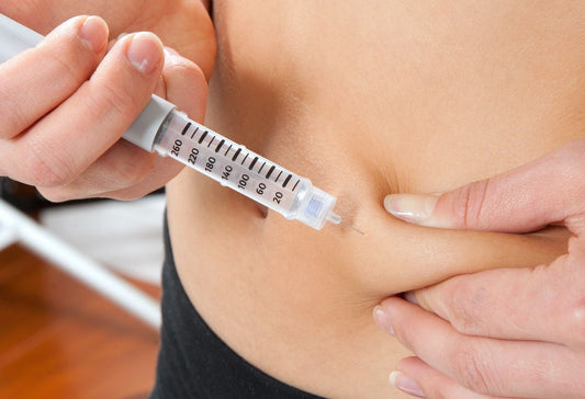 erson administering a weekly injectable GLP-1 medication for weight loss treatment